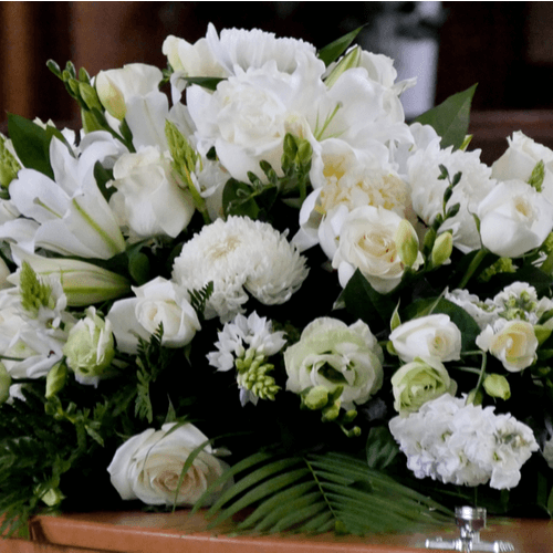 Premium white flower casket. 