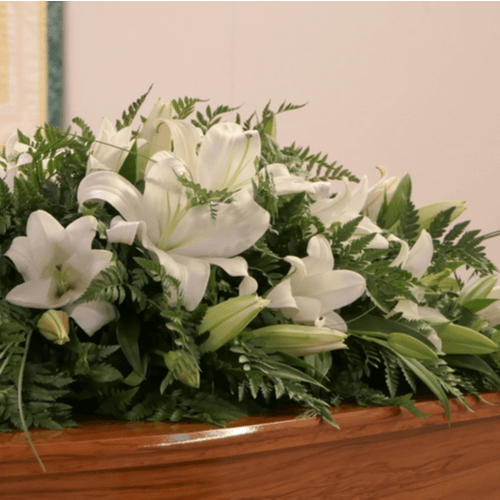White oriental lilies casket spray.