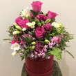 Red Hatbox of different shades of pink and white flowers