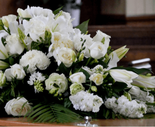 Premium white flower casket. 